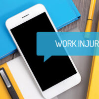 A Cellphone with the text "Work Injury" on the screen