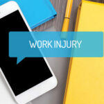 A Cellphone with the text "Work Injury" on the screen