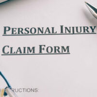 A piece of paper with the words "Personal injury claim form" written on it