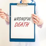 Clipboard with the words "wrongful death" written on it